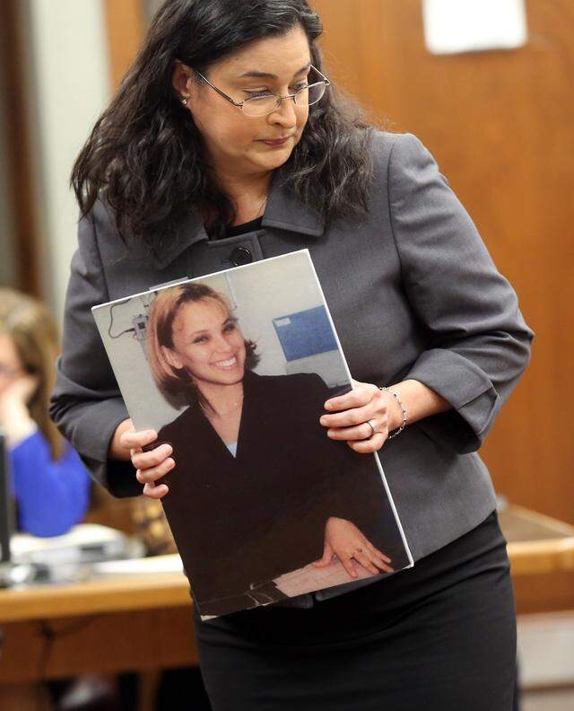 File art: Prosecutor Deisy Hernandez holds a photograph of Yvette Fariñas, murdered by Rafael Andres in 2005.
